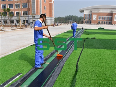 Brush glue in sideline of football court
